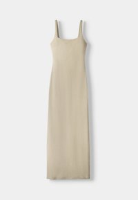 Beige linne maxiklänning med fyrkantig halsringning, tunna axelremmar och en enkel silhuett. Slät textur utan synliga mönster eller dekorationer.