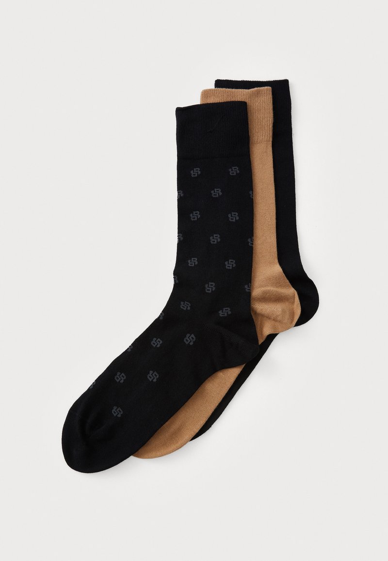 Drei Paar Socken: ein schwarzes Paar mit dezentem Muster, ein einfarbig schwarzes Paar und ein beiges Paar. Hergestellt aus weichem, dehnbarem Material mit verstärkten Bündchen.