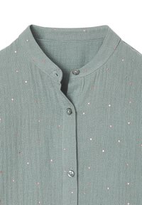 Hellgrüne Bluse mit Stehkragen, durchgehender Knopfleiste und einem Muster aus kleinen verstreuten rosa metallischen Punkten.