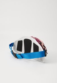 Fanny pack in white, pink, and burgundy with a structured, semi-circular design. Features a blue adjustable strap and black mesh accents.
