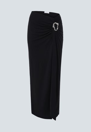 Black midi skirt with draped front detail and silver oval buckle on right hip against plain background.