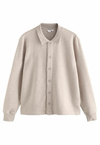 Cămașă butonată de un bej deschis, dintr-un material moale. Are guler, manșete lungi și șase butoane pe față pentru închidere.