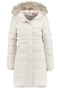 Puffer coat in light beige with a fur-lined hood, quilted design, zippered pockets, and ribbed cuffs for added warmth.