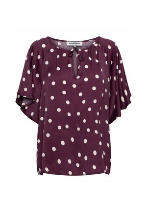 Paarse blouse met korte mouwen en witte polkadots, ronde hals met keyhole en striksluiting, losse pasvorm.