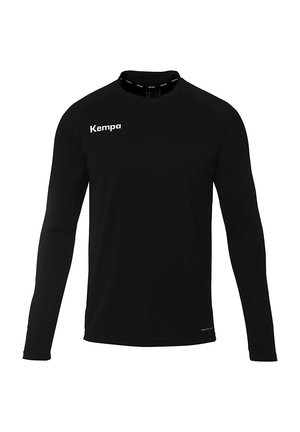 Mouwenlange zwarte sportshirt met ronde hals, gemaakt van lichte stof, met een wit "Kempa" logo op de borst en schouder.