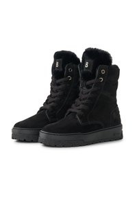 Zwarte suède enkellaarzen met imitatiebont voering, metalen veteroogjes en een vlakke rubberen zool. Heeft een gestructureerd oppervlak en een label op de tong.