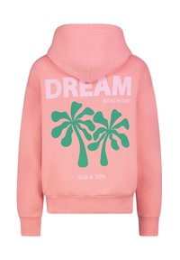 Rosa Kapuzenpullover mit einem großen grünen Palmbaum-Graphic, dem Text "DREAM BEACH DAY" und "SEA & SUN" in Weiß, mit gerippten Bündchen und Saum.