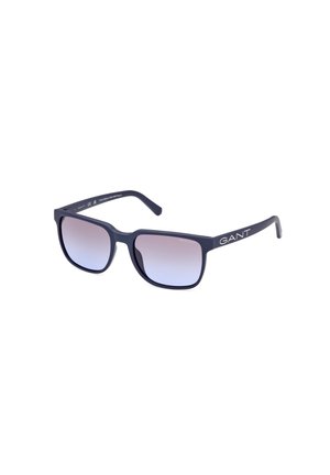 Occhiali da sole rettangolari con montatura opaca blu navy e lenti sfumate. Presentano il marchio bianco "GANT" sulla asta. Realizzati in materiale plastico leggero.