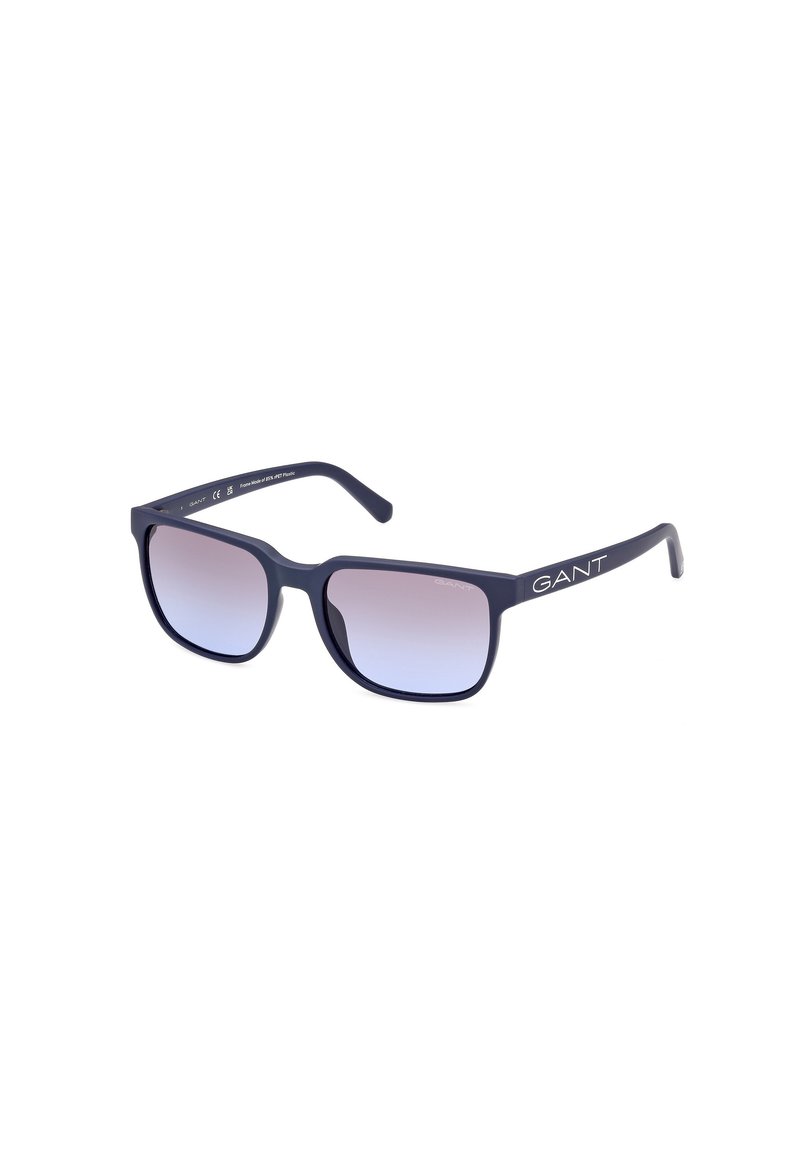 Rectangular sunglasses with a matte navy frame and gradient lens. Features white "GANT" branding on the temple. Lightweight plastic material.