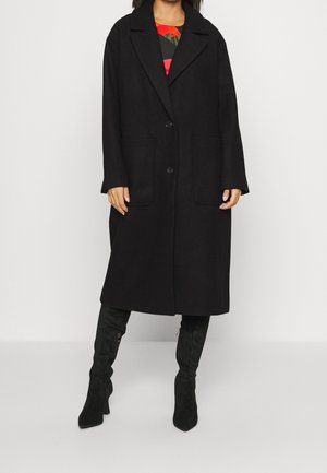 Black wool coat with a lapel collar, single button closure, and two front pockets. Features long sleeves and a relaxed fit.