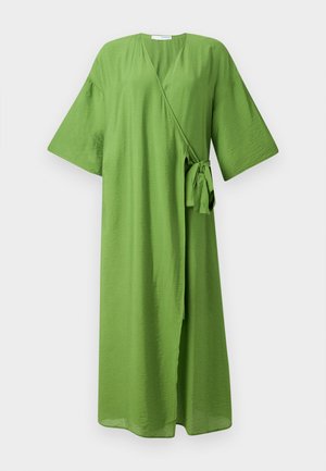 Green wrap dress made of lightweight fabric. Features wide sleeves, a waist tie, and a deep V-neck design. Smooth, slightly textured surface.