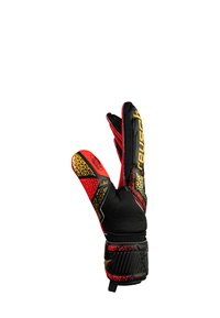 Guanto da portiere realizzato in materiale sintetico nero e rosso, con palmo testurizzato, dettagli dorati e un design unico a motivi sul polsino.