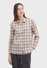 Braun- und cremefarbener karierter Button-Up-Hemd mit Kragen, langen Ärmeln und einem leicht abgerundeten Saum. Leinenmischung mit einer glatten Textur.