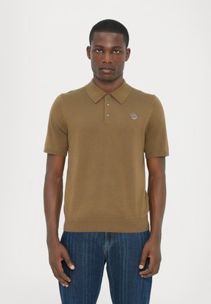 Brown short-sleeve polo shirt with a ribbed texture and three-button placket, featuring a small embroidered logo on the left chest.