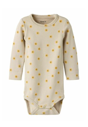 Body beige à manches longues pour bébé avec petits motifs de fleurs jaunes et marron et boutons-pression à l'entrejambe.