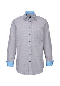 Camicetta blu a fantasia con maniche lunghe, polsini azzurri a contrasto e una piccola tasca sul petto. Realizzata in tessuto leggero.