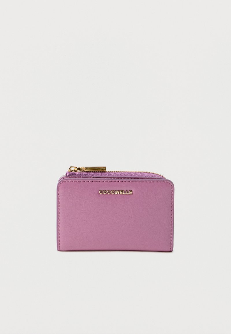 Pink leather wallet with a smooth texture, featuring a gold zipper and logo detailing on the front. Rectangular shape. Compact design.