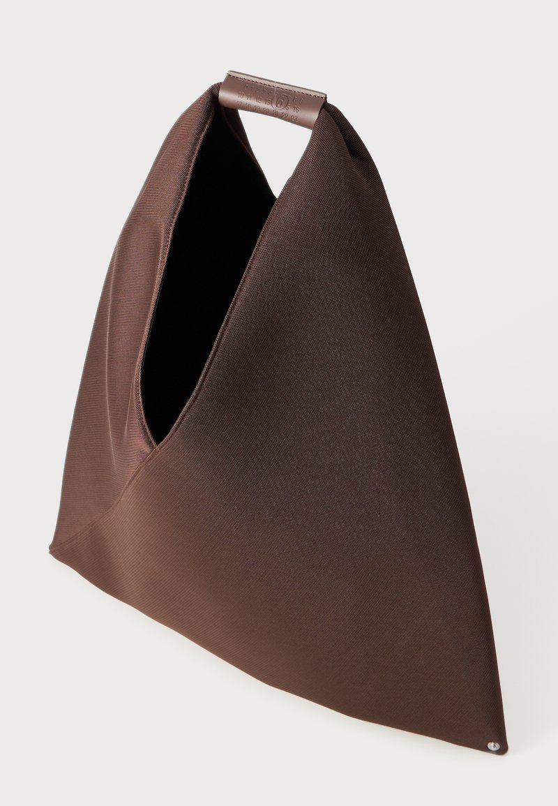 Brown fabric tote bag with a triangular shape, featuring a smooth texture, a large opening, and a top handle for carrying.