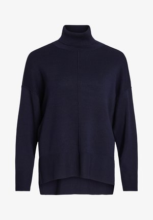 Námořnický modrý rolák s uvolněným střihem, žebrovanými manžetami a lemem, který se pyšní středovým švem a měkkou texturou.