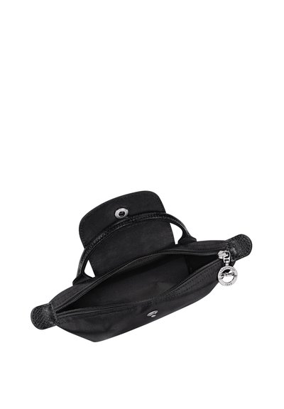 Black rectangular handbag with top handles, open zipper compartment, snap button flap, and round branded zipper pull.