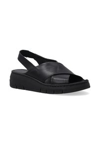 Schwarze Leder-Sandalen mit offenem Zehenbereich, geneigtem Design und einer dicken schwarzen Gummisohle. Sie verfügen über einen Slingback-Riemen und gestickte Details.