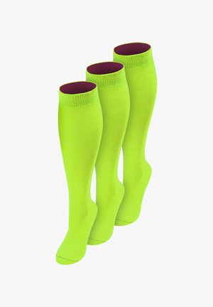 Drei Paare knallgelb-grüner kniehoher Socken mit dunkelviolettem Innenfutter, nebeneinander auf weißem Hintergrund angeordnet.