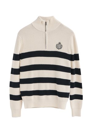 Hoge nektrui in crème met marineblauwe en witte strepen. Voorzien van een ritskraag en geborduurd logo op de borst. Geribbelde textuur.