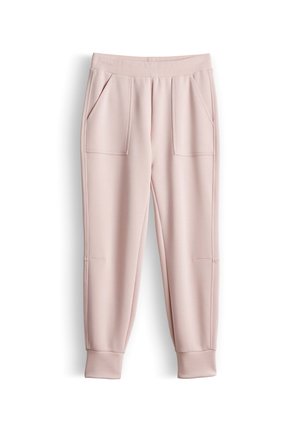 Hellrosa Jogginghose mit geripptem elastischem Bund, aufgesetzten Fronttaschen, zulaufenden Beinen und gerippten Bündchen.
