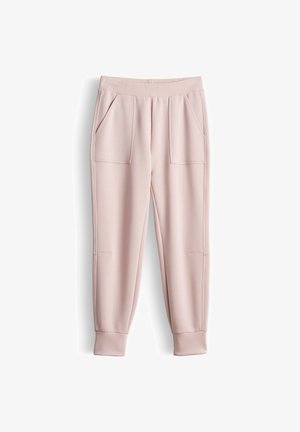 Lichtroze joggingsbroek met geribbelde elastische tailleband, opgestikte voorzakken, taps toelopende pijpen en geribde boorden.