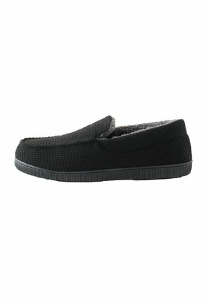 Black textured slip-on slipper with gray fleece lining and black rubber sole, shown in profile facing right on white background.