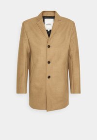 Manteau marron en mélange de laine avec un col cranté, quatre boutons noirs, deux poches latérales et une coupe droite. Intérieur doublé.