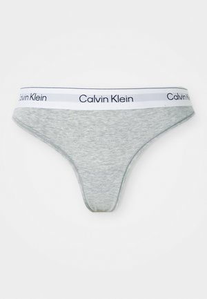 Grijze katoenen slip met een witte elastische tailleband waarop "Calvin Klein" in zwarte letters staat. Glad textuur en aansluitend ontwerp.