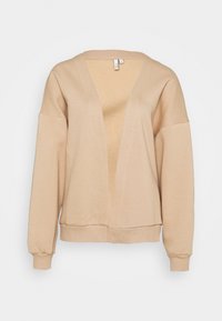 Cárdigan beige de corte holgado en material suave, con escote en V profundo, hombros caídos y puños y dobladillo acanalados.