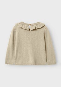 Pull en tricot beige avec des manches longues, un col volanté, une fermeture à boutons au dos et des détails de frange au bas. Texture douce et design décontracté.