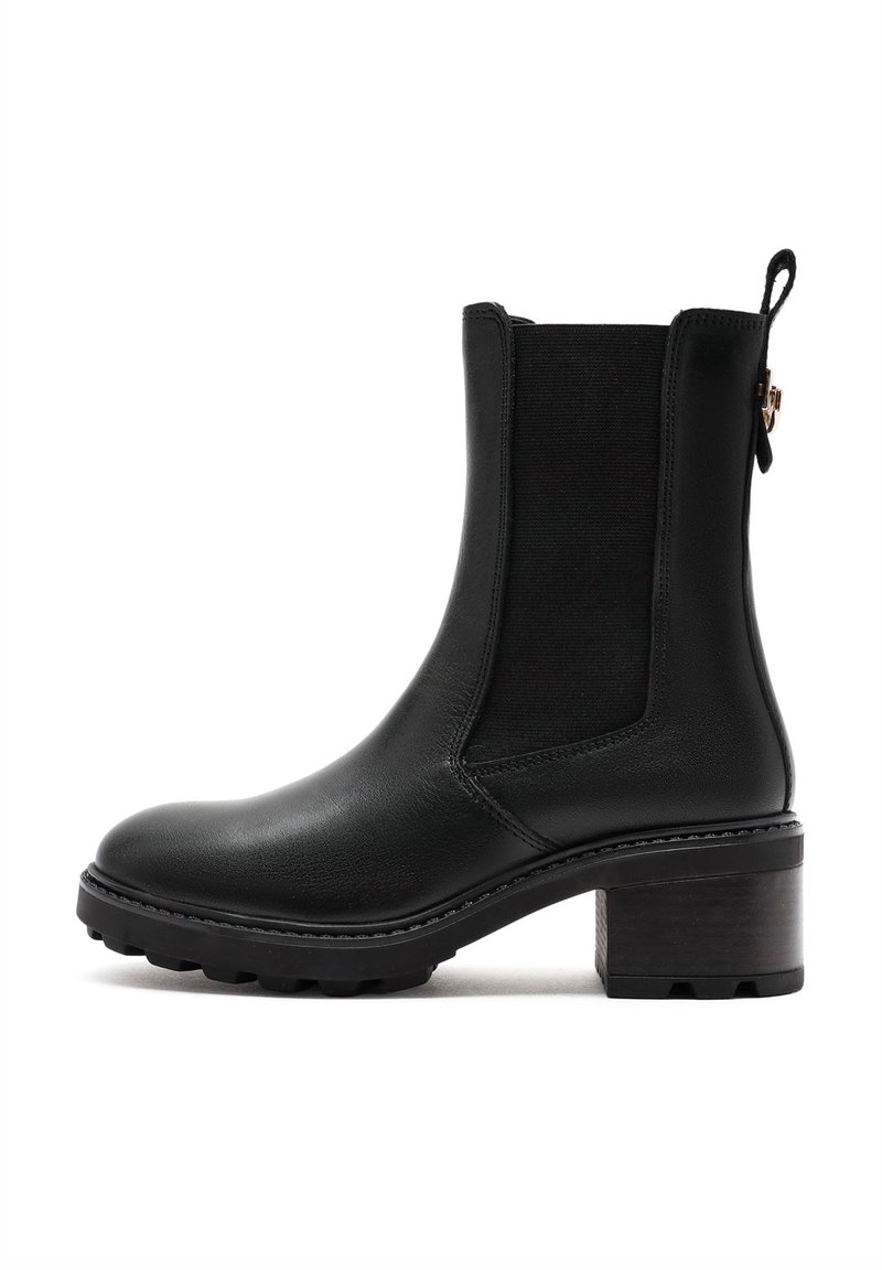 Black leather ankle boot with elastic side panels, rounded toe, and a textured block heel. Detailed stitching and a pull tab at the back.