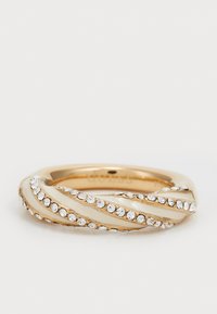 Gold-toned twisted ring featuring white enamel accents and a row of clear gemstones embedded along the surface. Smooth, polished finish.
