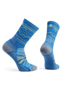Calcetines azules con un diseño geométrico; material en azul y gris, con detalles en amarillo y un talón acolchado para mayor comodidad.