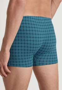 Teal geklede boxershorts met geometrische patronen, gemaakt van rekbare stof, met een comfortabele tailleband en aansluitend ontwerp.