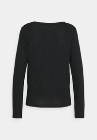 Svart långärmad topp i texturerat, glittrigt tyg. Har en rundad halsringning och en åtsittande form. Bakifrånperspektiv, inga synliga knäppningar.