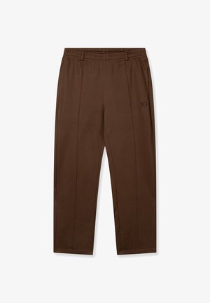Pantalon de jogging marron avec une ceinture élastique, présentant des coutures latérales et un petit logo sur la jambe gauche. Fabriqué en tissu doux et léger.