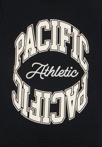 Black sweatshirt featuring large white text "PACIFIC" and "Athletic" in a circular design. Text is printed in bold with contrasting font styles.