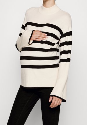 Gestrickter Pullover in Creme mit schwarzen horizontalen Streifen. Hat einen hohen Kragen und Glockenärmel, designed für einen entspannten Schnitt.