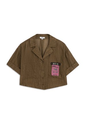Short-sleeve, cropped shirt in textured brown fabric with a notch collar and button closure. Features a printed label on the left side.