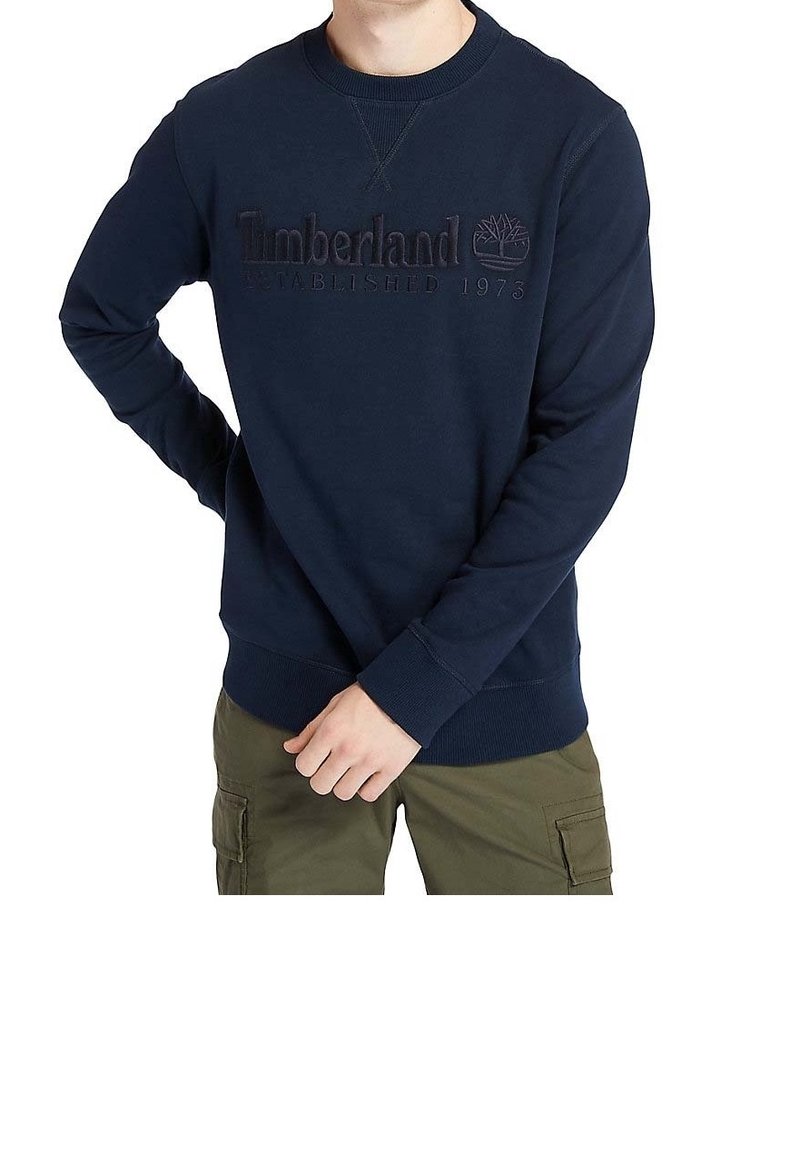 Mörkblå sweatshirt i bomullsblandat material, med ribbad ärmslut och nedre fåll, prydd med broderad "Timberland" och logotyp.