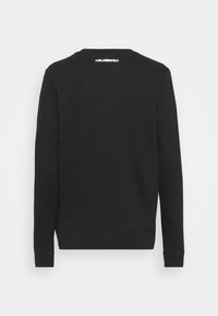 Sweatshirt noir à manches longues avec le texte "KARL LAGERFELD" imprimé en blanc près de l'encolure au dos.