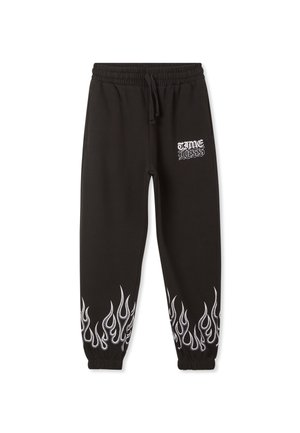 TUTA CON STAMPE FIAMME - Pantaloni sportivi - nero
