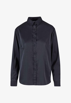 Tume sinine, pikade varrukatega nööpidega särk, mis on valmistatud sileda ja läikiva kangaga. Omab klassikalist kraed ja kuut esinööpi.