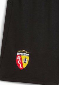 Sort sportsjersey med Racing Club de Lens-logo. Struktureret stof med guld, rød og gul accentuerende farver og et markant våbenskjold design.