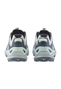 Dark blue and light green hiking shoes with mesh and suede materials, cushioned soles, and a unique heel design for stability.