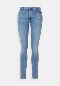 Jeans ajustados de mezclilla azul claro con un lavado desgastado, diseño de cinco bolsillos y cierre de botón de metal. Presentan un ajuste ajustado y dobladillo a la altura del tobillo.